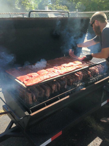 Meadow Creek PR60 Pig Roaster Loaded With Ribs With Second Tier Grate and Rib Rack