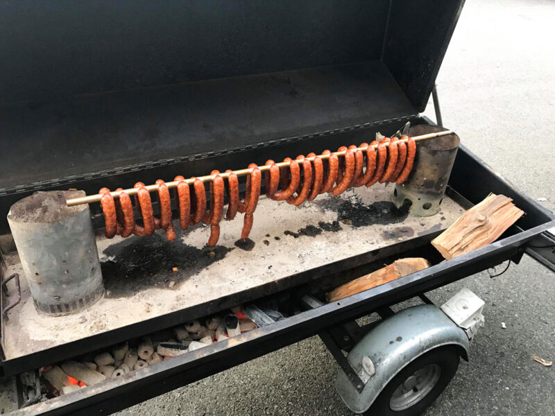 Grilled Sausages on a Meadow Creek Pig Roaster